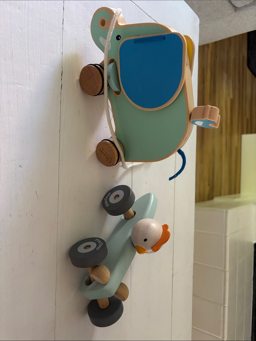 PlanToys Chick Push Wooden Car and Classic World elephant pull toy.